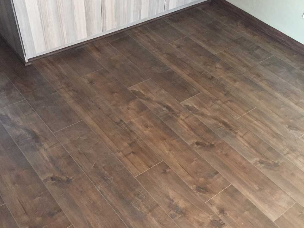 Newly laid African walnut laminate floor