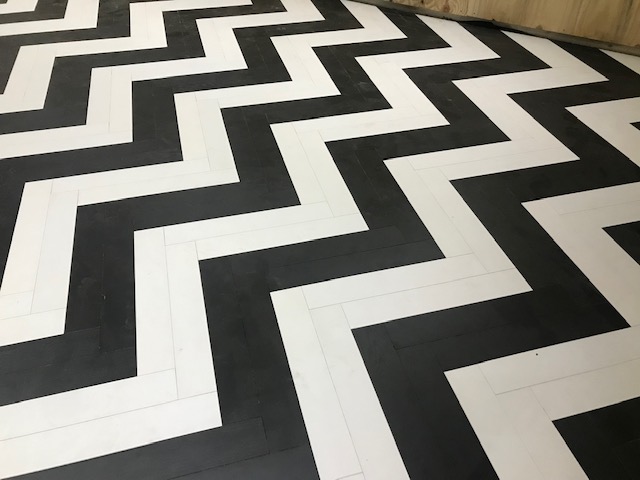 black and white herringbone flooring