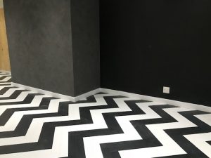 black and white herringbone flooring