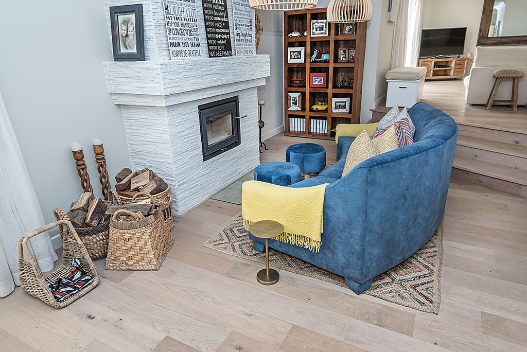 Pre-finished Outeniqua wood floors with a fire place