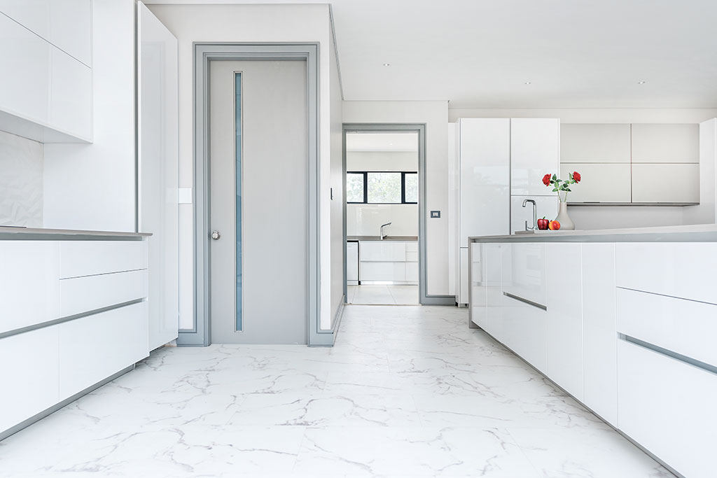 Moonstone vinyl tiles in modern white kitchen