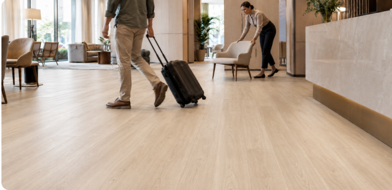 Laminate vs LVT commercial flooring durability in a high-traffic hotel lobby.